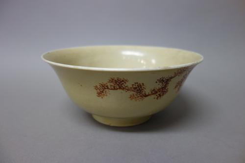 A Chinese porcelain bowl, blue painted Qianlong seal mark, painted on the exterior in brick-red with gilt highlights with a sage standing in a landsca