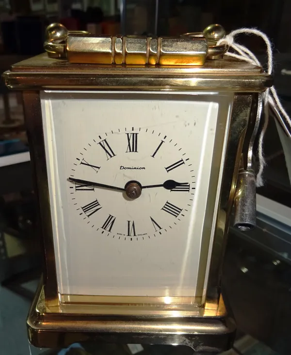 An early 20th century cased carriage clock with key. 12cm tall   CAB