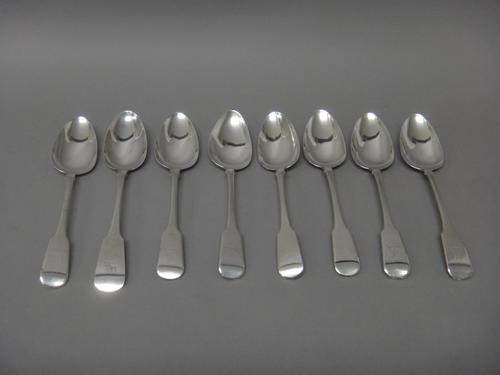 Eight Irish silver fiddle pattern tablespoons, Dublin, comprising; one 1817, one 1819 and six 1820, combined weight 554 gms, (8).