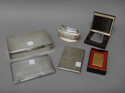 A silver rectangular table cigarette box, wooden lined within, Birmingham 1955, a rectangular cigarette case, detailed 800, a plated rectangular cigar