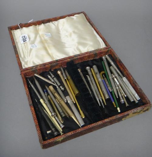 A collection of silver, gold plated, base metal and other writing implements, mostly pencils, including a silver cased pencil, London 1916, a Sterling