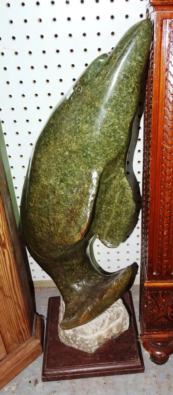 A 20th century green hardstone sculpture modelled as a dolphin, 64 cm high. H10
