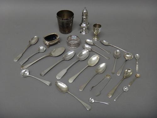 Silver, comprising; a small caster, a salt, a napkin ring, a small trophy cup, a pair of sugar tongs, a rat tail pattern spoon, seven condiment spoons