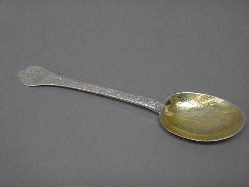 A silver treffid end rat tail pattern spoon, probably late 17th century, having later engraved decoration and with a gilt bowl, length 18.5cm, weight