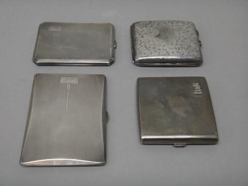 A silver rectangular cigarette case, with engine turned decoration, Birmingham 1934, a silver cut cornered rectangular cigarette case, with engine tur