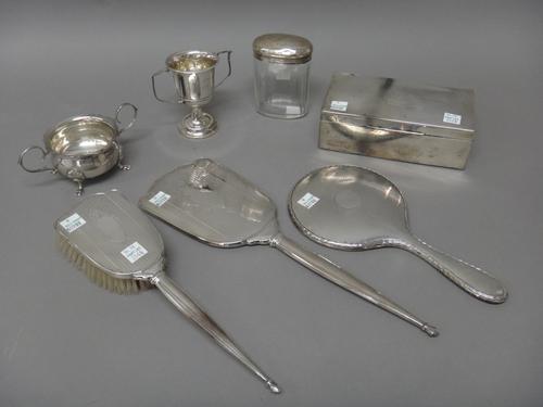 Silver and silver mounted wares, comprising; a rectangular table cigarette box, wooden lined within, a twin handled sugar bowl, Birmingham 1967, two h
