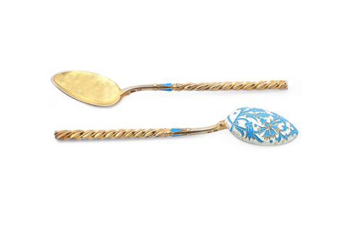 A set of twelve Russian style pale blue and cream coloured enamelled gilt spoons, each detailed with enamelled floral decoration to the back of the bo