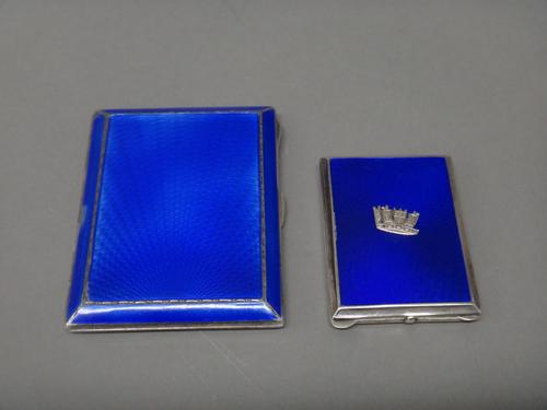A silver and blue enamelled rectangular cigarette case, Birmingham 1933 and a silver and blue enamelled rectangular book matches case, Birmingham 1934