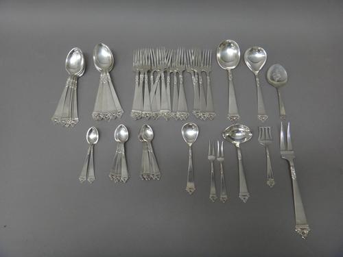A European part table service of flatware, comprising; eighteen dessert forks, twelve dessert spoons, thirteen tea spoons, a serving spoon and fork, a