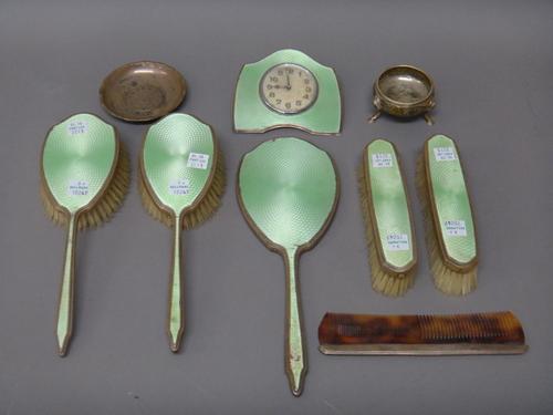 Mostly silver mounted wares, comprising; a green enamelled part dressing set, comprising; a hand mirror, two clothes brushes and a hair brush, various