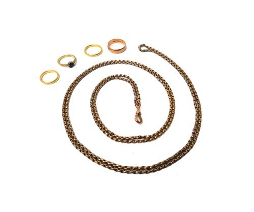 A gold faceted oval link long guard chain, detailed 9C, fitted with a swivel, detailed 9CT, length 137cm, weight 27 gms, a gold ring mount (the centra