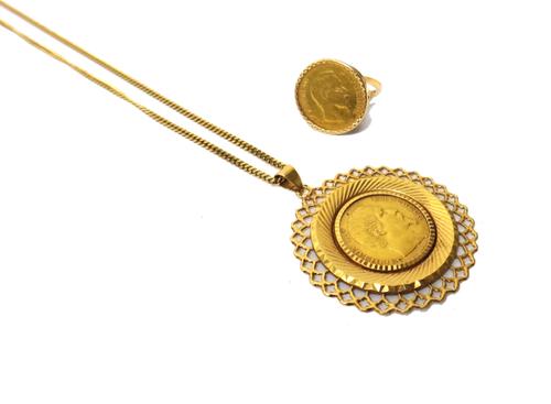 A French gold 20 Francs 1855 A in a gold pendant mount, with a gold faceted curb link neckchain on a bolt ring clasp and a French gold 10 Francs 1858,