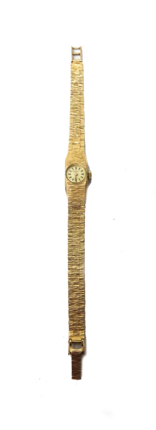 A Rotary 9ct gold lady's bracelet wristwatch, the signed circular dial with baton numerals, the tapering bracelet having a bark textured finish, with