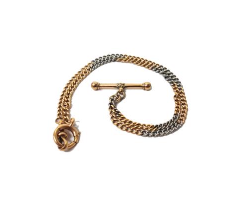 A two colour gold uniform curb link watch Albert chain, fitted with a swivel detailed 18, a T bar and a bolt ring, weight 15 gms.