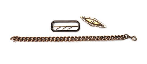 A 15ct gold and diamond brooch, star gypsy set with a cushion shaped diamond to the centre, within a beaded and wire work surround, Birmingham 1899, a