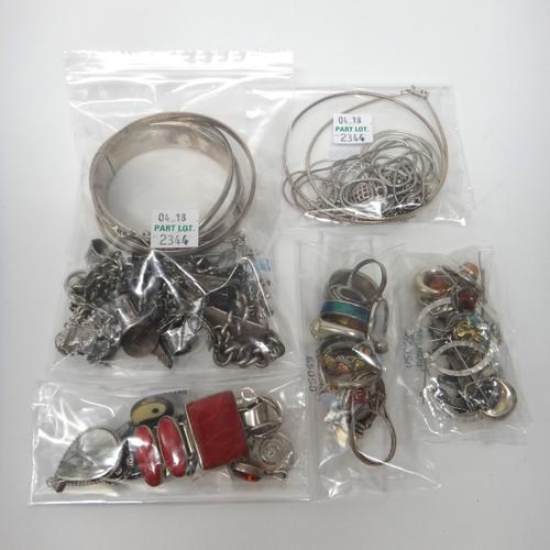 Silver and other jewellery, comprising; an oval hinged bangle, a charm bracelet, two circular bangles, four bracelets, ten rings, six pairs of earring