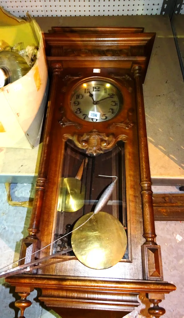 A 20th century Continental walnut wall mounted clock, with eight day movement, 37cm wide x 103cm long.  S4B