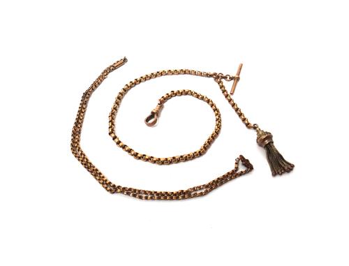 A gold faceted circular link dress Albert chain, detailed 9C, fitted with a T bar and a swivel, detailed 9C and with a pendant tassel and a gold neckc