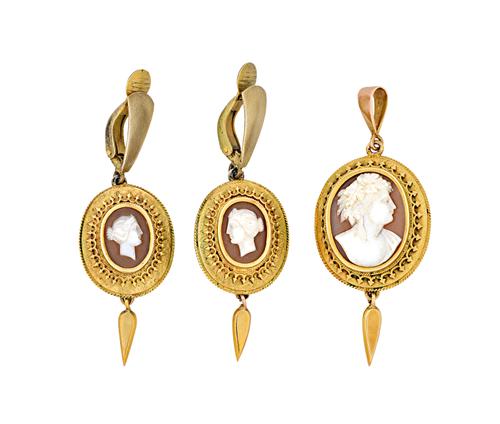 A Victorian gold mounted oval shell cameo pendant and a similar pair of pendant earrings, the tops of these with later associated gilt metal clips, ea
