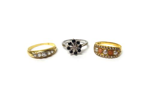 A gold and diamond set five stone ring, mounted with a row of cushion shaped diamonds, graduating in size to the centre stone, a Victorian 18 ct gold,