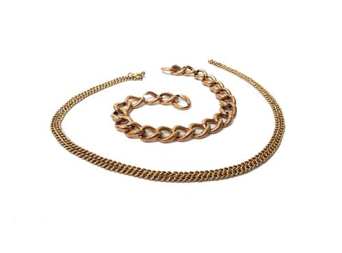 A gold hollow curb link neckchain, on a boltring clasp and a gold hollow curb link bracelet (the clasp lacking), combined weight 18.6 gms, (2).
