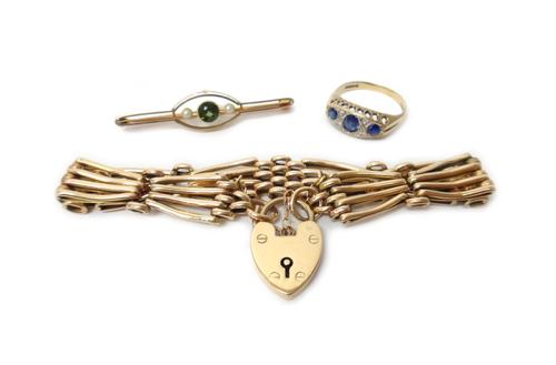 A gold bar and oval link gate bracelet, detailed 15, on a gold heart shaped padlock clasp, detailed 15, weight 16 gms, a 9ct gold, blue and colourless