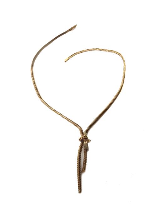 A 9ct gold necklace, in a flat foxtail linkage design, the twistover front, decorated with foliate motifs, on a fold-over clasp, Birmingham  1970, wei