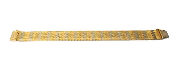 A two colour gold bracelet, having a textured finish, on a snap clasp, detailed 0,750, with a fold-over safety catch, length 17.5cm, weight 31.5 gms,