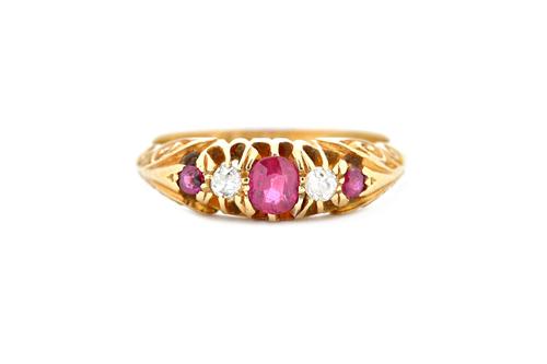 An 18ct gold, ruby and diamond set five stone ring, mounted with three cushion shaped rubies, alternating with two cushion shaped diamonds, Chester 19