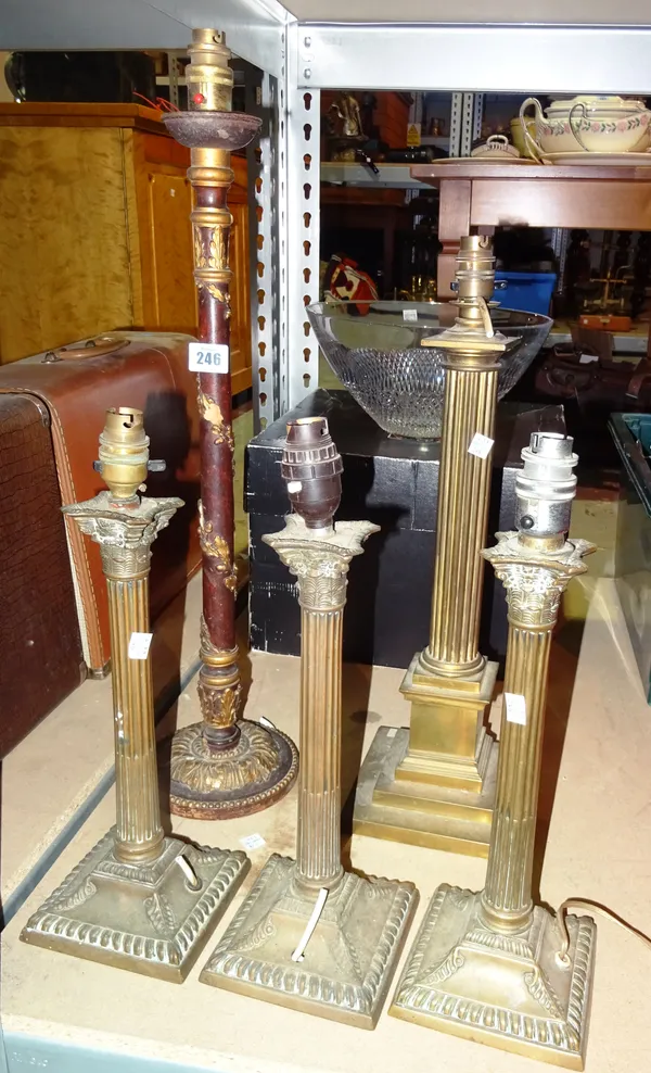 Lighting, comprising; four brass Corinthium column style table lamps and a wooden and gilt table lamp, 64cm tall (5)  S2B