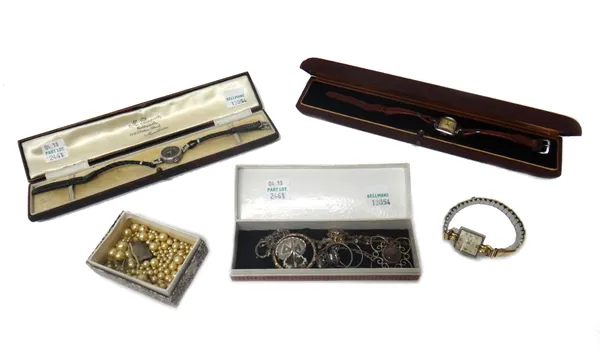 Two E. Gubelin, Lucerne square cased lady's wristwatches, another lady's wristwatch, having a black dial, with three cases, three R.A.F brooches and b