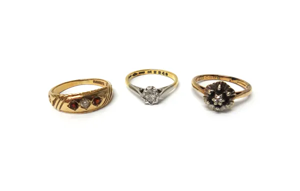 A gold and diamond set single stone ring, mounted with a circular cut diamond, a 9ct gold, diamond and sapphire set seven stone cluster ring and a 9ct