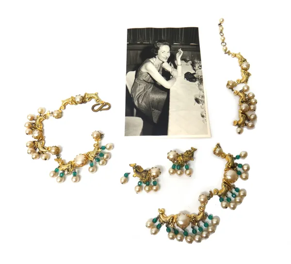 A Christian Dior gilt metal, imitation pearl and green paste bead necklace (in three sections), decorated with dolphin motifs and pendant drops, detai