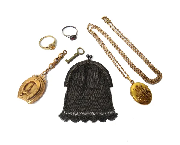A gold pendant locket, having a horseshoe motif, fitted to a short length of chain, an oval pendant locket, with a gilt metal curb link neck chain, tw