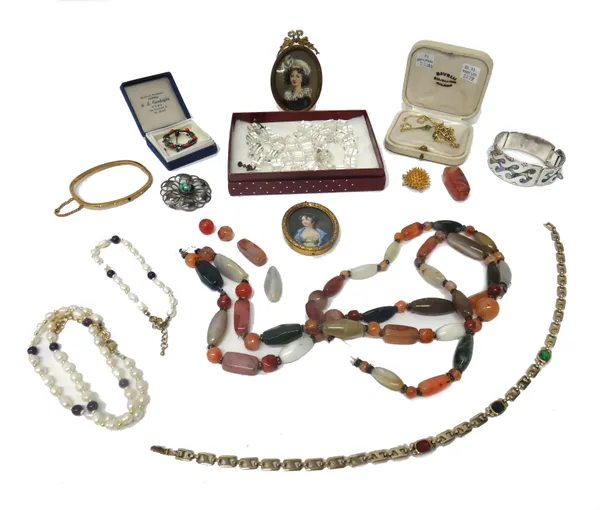 A silver gilt and emerald set three piece set, comprising; a necklace, a bracelet and a ring, a gilt metal and paste set bangle, a silver and abalone