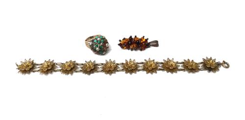A gold, half pearl and vary coloured gem set ring, in a wirework and raised design (one ruby lacking), a vary coloured amber bead pendant, detailed 92