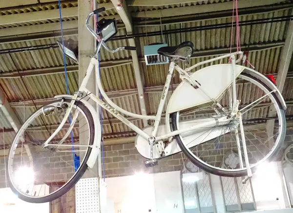 A mid-20th century "Altra" Dutch style fixed wheel bike, painted white.  HANG