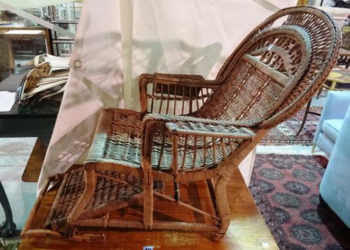 A 20th century child's adjustable cane armchair, the back detailed Madeira 1935.   C3