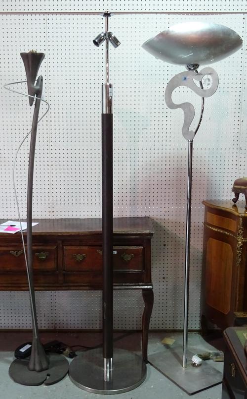 A modern silvered metal 'Lucecrea' standard lamp, with shaped glass shade, 190cm high, and two further contemporary standard lamps, one stamped 'Masca