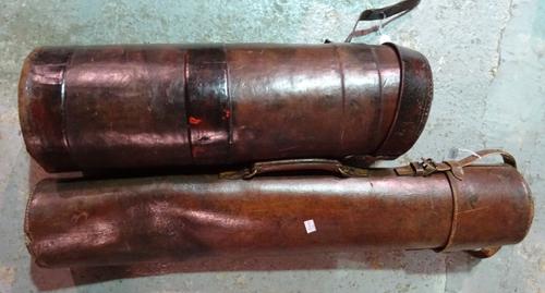 An early 20th century brown leather golf club bag and a cylindrical brown leather box possibly for umbrellas, (2).  I3