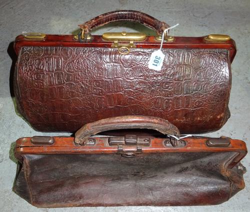 An early 20th century small brown leather Gladstone type bag and another, the larger 41cm x 21cm, (2).  H2