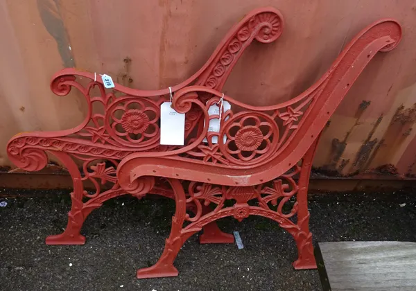 A late 19th/early 20th century pair of cast iron bench ends, withpierced decoration.  OUT