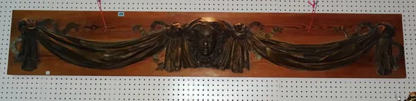 A gilt faux plaster style swag and mask embellishment/surmount, 180cm wide.  J10