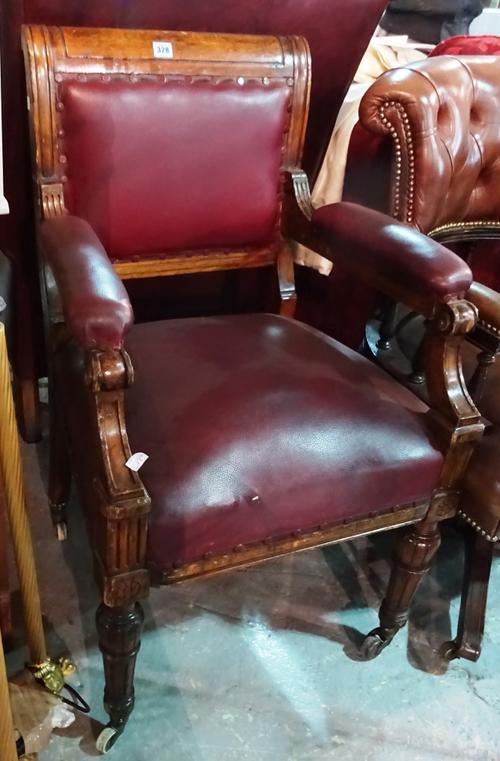 A Victorian oak framed open armchair, on fluted baluster supports, 60cm wide x 95cm high,  F5