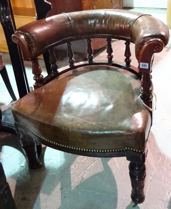 A Victorian leather upholstered walnut framed tub back office chair, on turned supports, 69cm wide x 74cm high.  I8