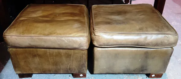 A pair of 20th century leather square footstools, on block supports, 51cm wide x 38cm high, (2).  K2