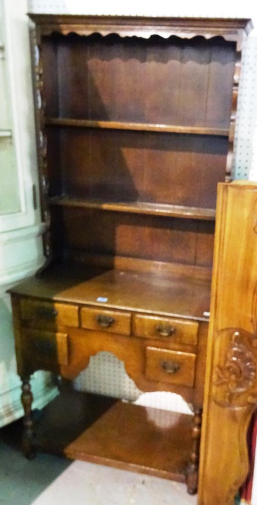 An early 20th century oak dresser with a three tier plate rack, 76cm wide x 160cm high.  M10