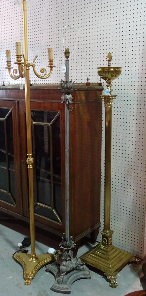 A Victorian style brass standard lamp of Corinthian column form, 140cm high, a modern gilt metal three branch standard lamp, and one further standard