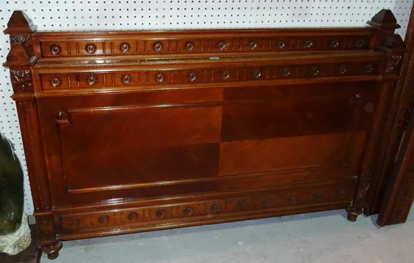 An early 20th century Continental beech framed single bed with carved decoration, 142cm wide x 94cm high.   G10