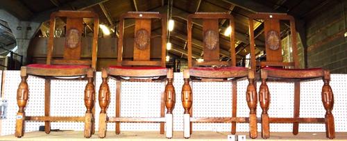 A set of four 20th century oak square back dining chairs with carved inset panel, (4).  M3